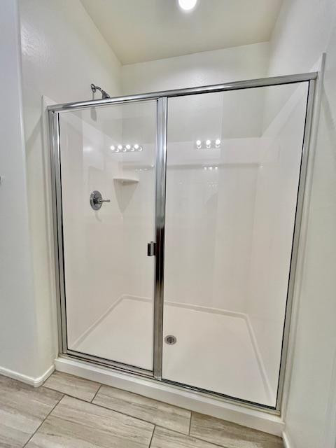 71 West Megan Street Gilbert, AZ 85233 - Photo 30 of 39 a bathroom with a glass shower door