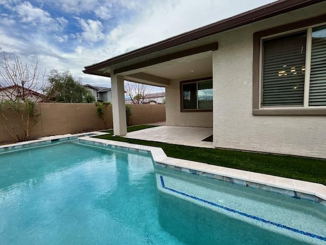 71 West Megan Street Gilbert, AZ 85233 - Photo 38 of 39 a view of swimming pool with a yard
