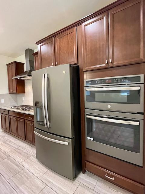 71 West Megan Street Gilbert, AZ 85233 - Photo 4 of 39 a metallic refrigerator freezer sitting in a kitchen