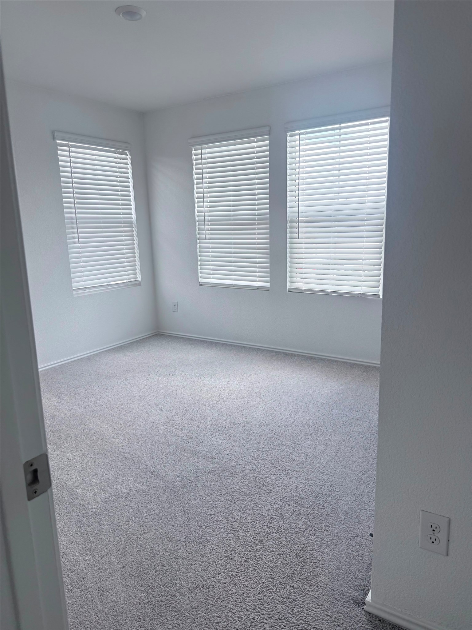 192 Rodney Boat Road Kyle, TX 78640 - Photo 39 of 40 A well-lit room offering a comfortable and neutral canvas, ready for personalization.