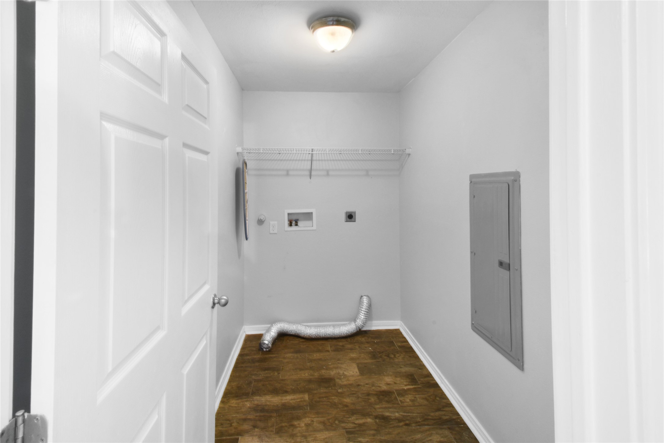 320 10th Street Dickinson, TX 77539 - Photo 21 of 21 Discover the practicality of this spacious utility room, featuring ample space for all your organizational needs.