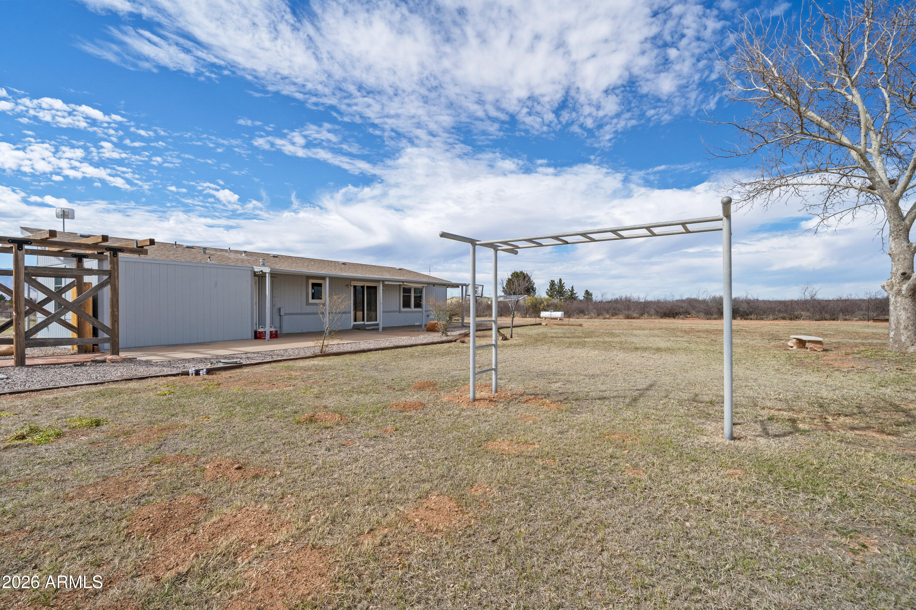 10072 South Shiloh Ranch Road Hereford, AZ 85615 - Photo 30 of 46 a view of an house with backyard space