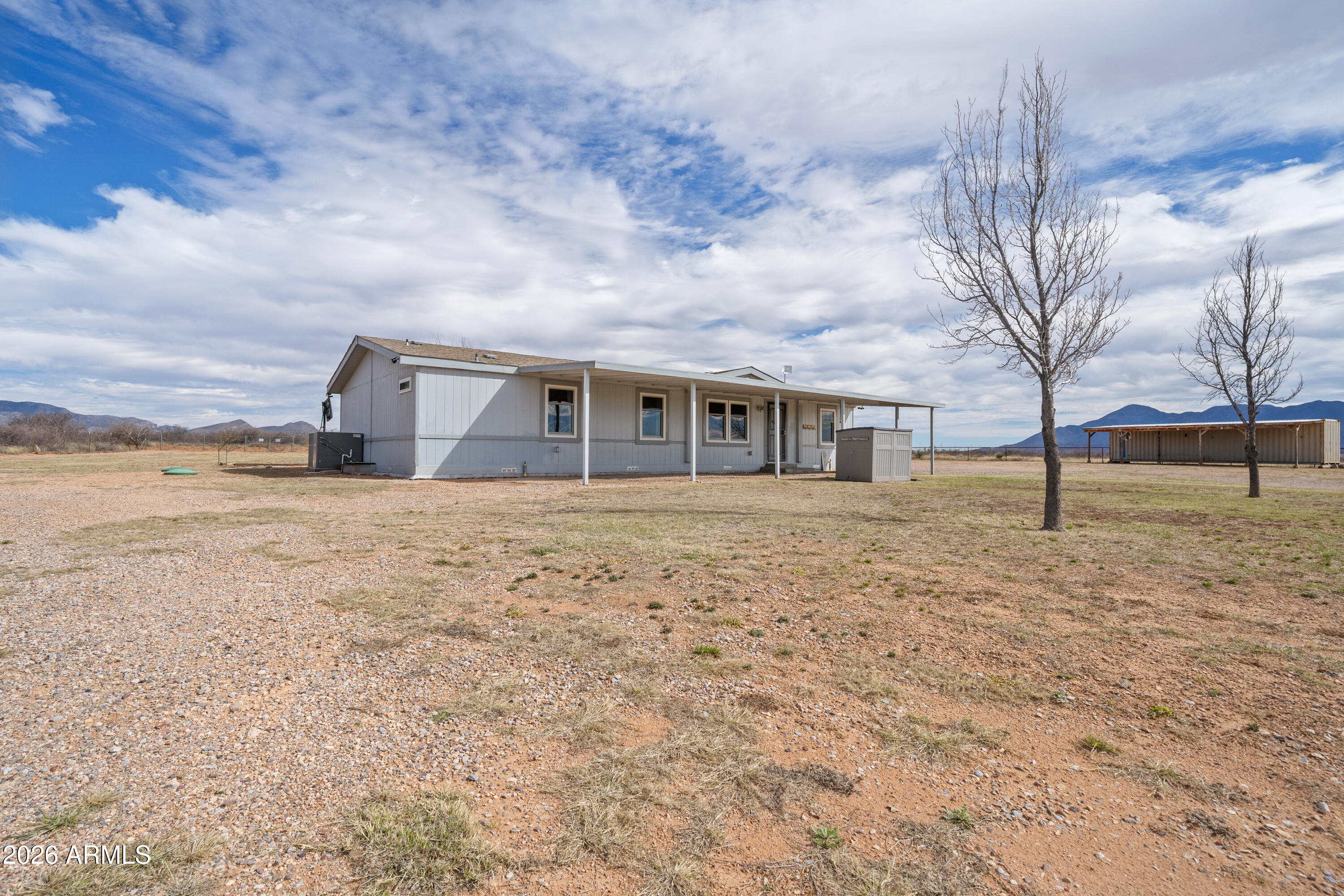 10072 South Shiloh Ranch Road Hereford, AZ 85615 - Photo 34 of 46 a house view with a backyard space