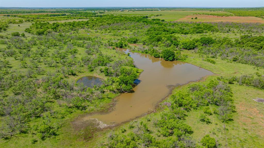 0 Troy Davis Road Olney, TX 76374 - Photo 3 of 37 a view of a lake with a yard