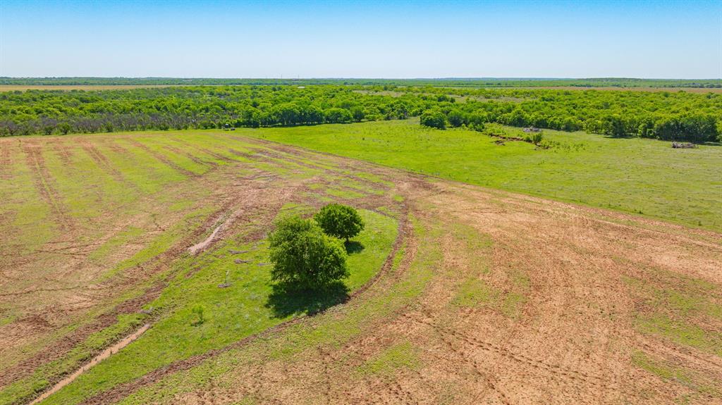 0 Troy Davis Road Olney, TX 76374 - Photo 34 of 37 a view of a green yard with an outdoor space