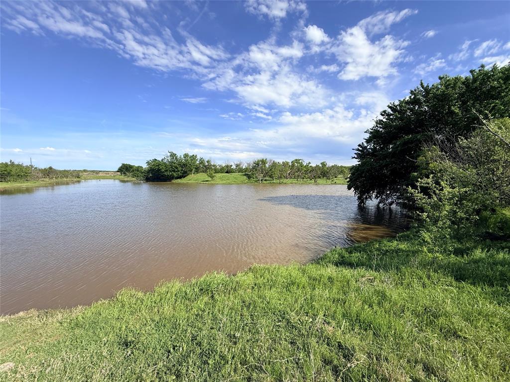 0 Troy Davis Road Olney, TX 76374 - Photo 36 of 37 a view of a lake from a yard