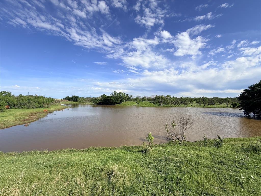 0 Troy Davis Road Olney, TX 76374 - Photo 8 of 37 a view of a lake from a yard