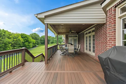 a view of balcony with chairs and wooden floor