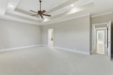 a view of a livingroom with a ceiling fan and window