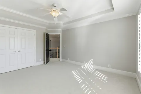 a view of a livingroom with a chandelier fan