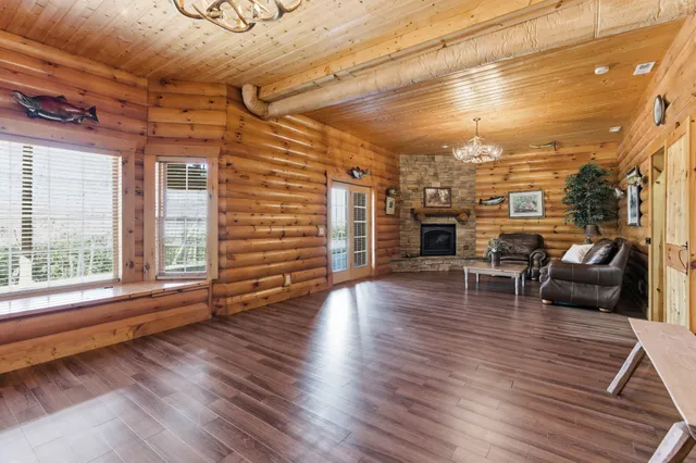a view of a livingroom with furniture and a fireplace
