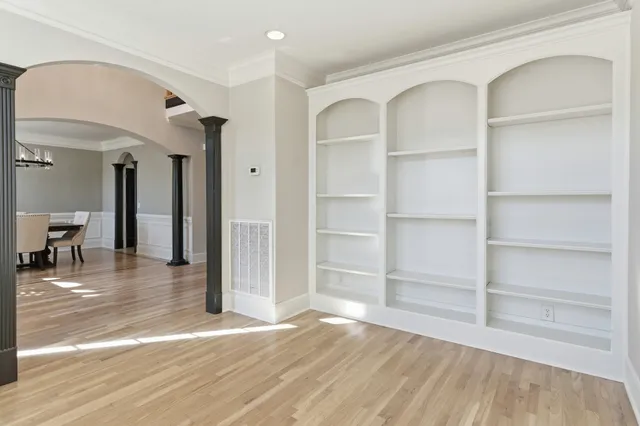 a view of a room with wooden floor and closet