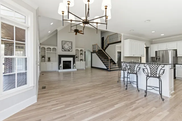 a view of entryway dining room and hall with wooden floor