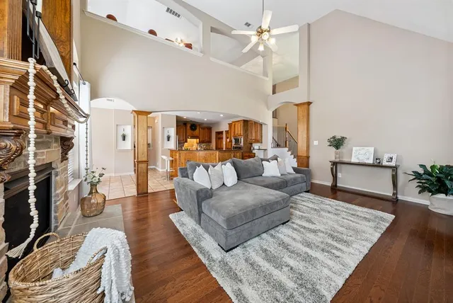 a living room with furniture and wooden floor