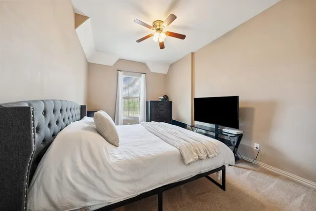 a bathroom with a sink a toilet and shower curtain