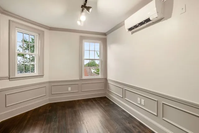 a view of room with window and hardwood floor