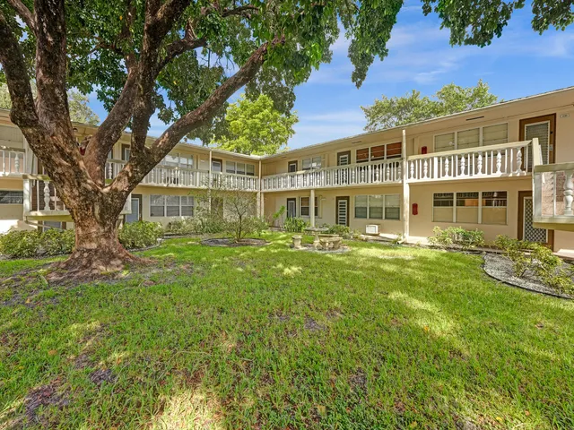 front view of a house with a garden