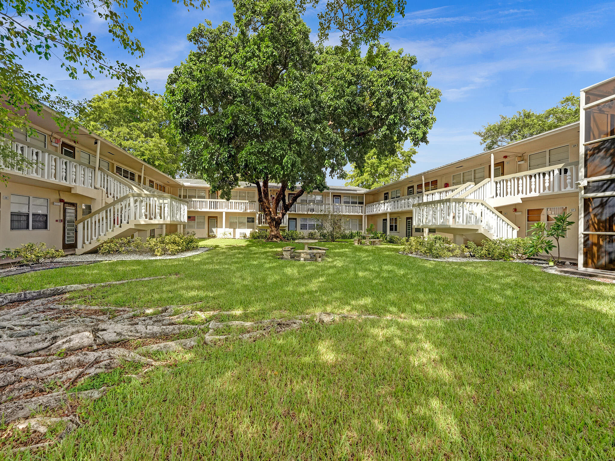 232 Farnham J, Unit 232 Deerfield Beach, FL 33442 - Photo 37 of 38 a view of a house with a yard