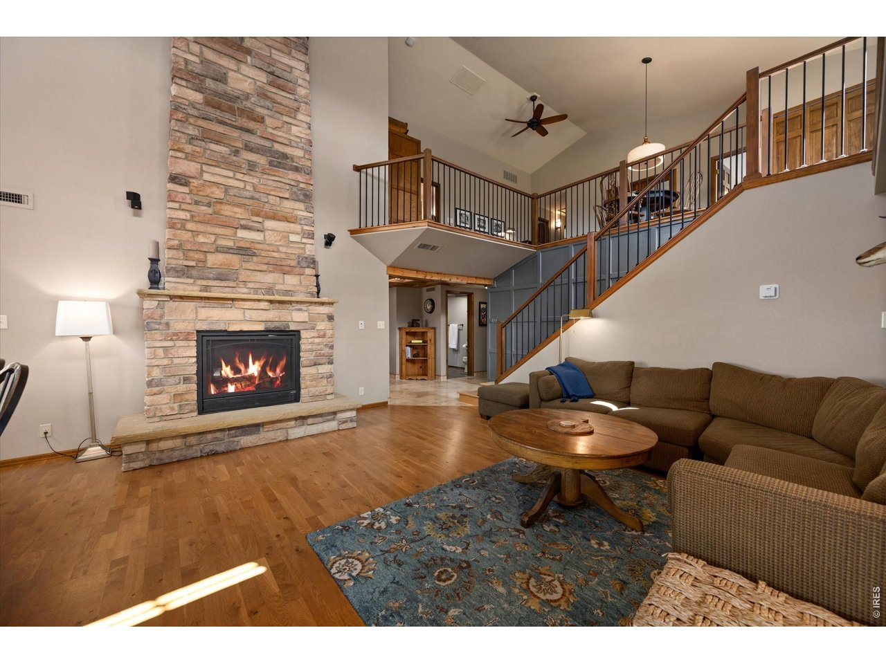 7600 Rita Lane Fort Collins, CO 80524 - Photo 13 of 50 Two-Sided Gas Fireplace Connects to the Kitchen