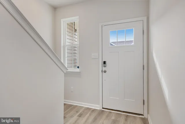 a view of room with window and entryway