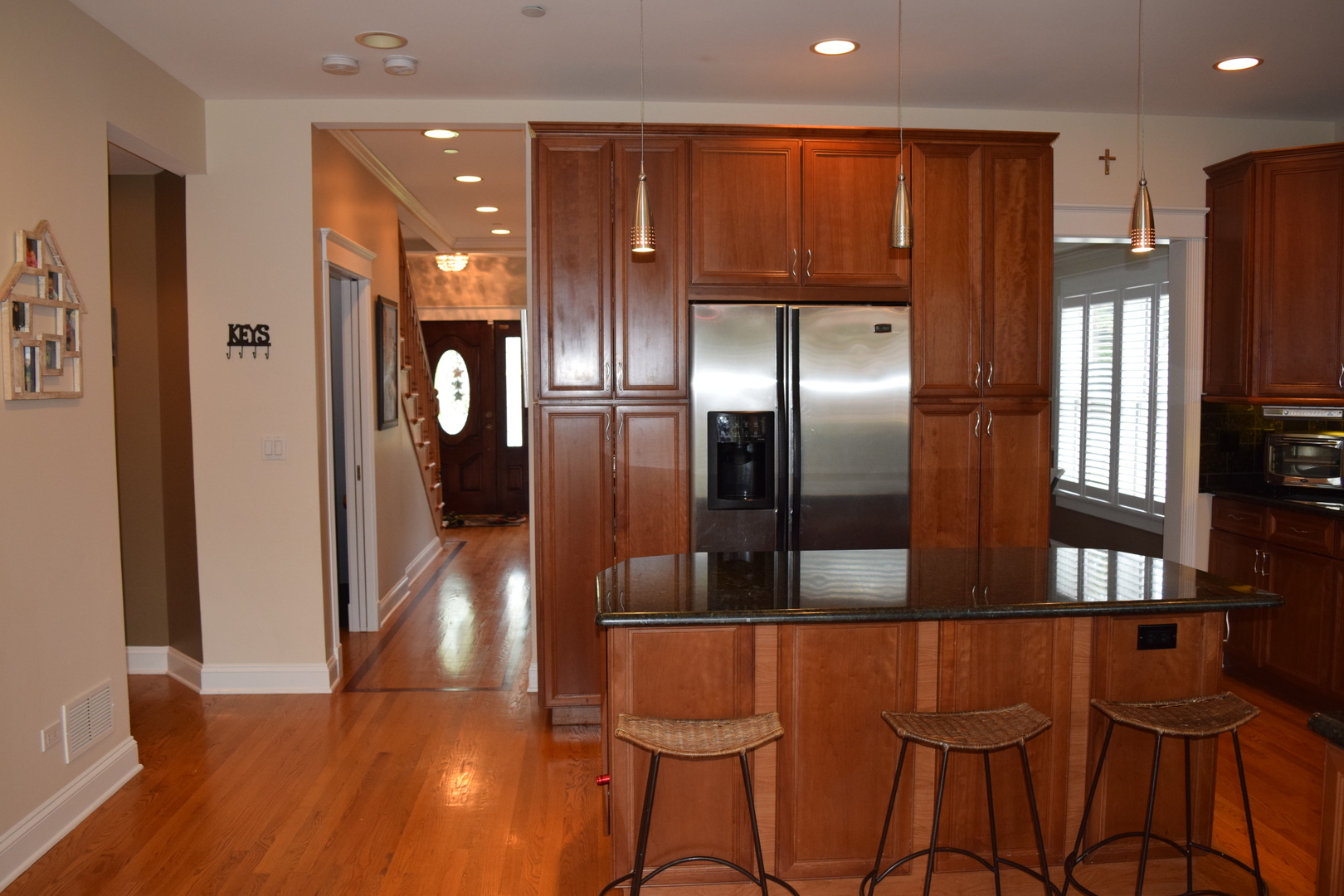 707 North Delphia Avenue Park Ridge, IL 60068 - Photo 4 of 22 a kitchen with stainless steel appliances kitchen island granite countertop a refrigerator and cabinets
