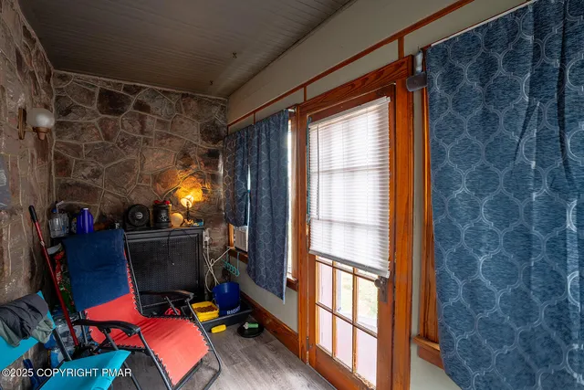 a room with furniture and musical instruments