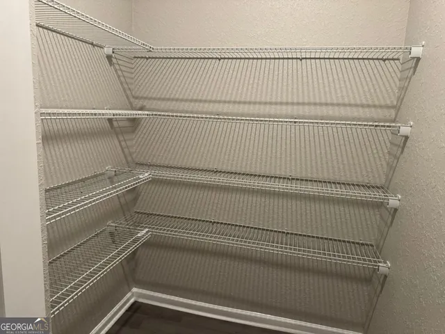 a view of a room with racks on the wall