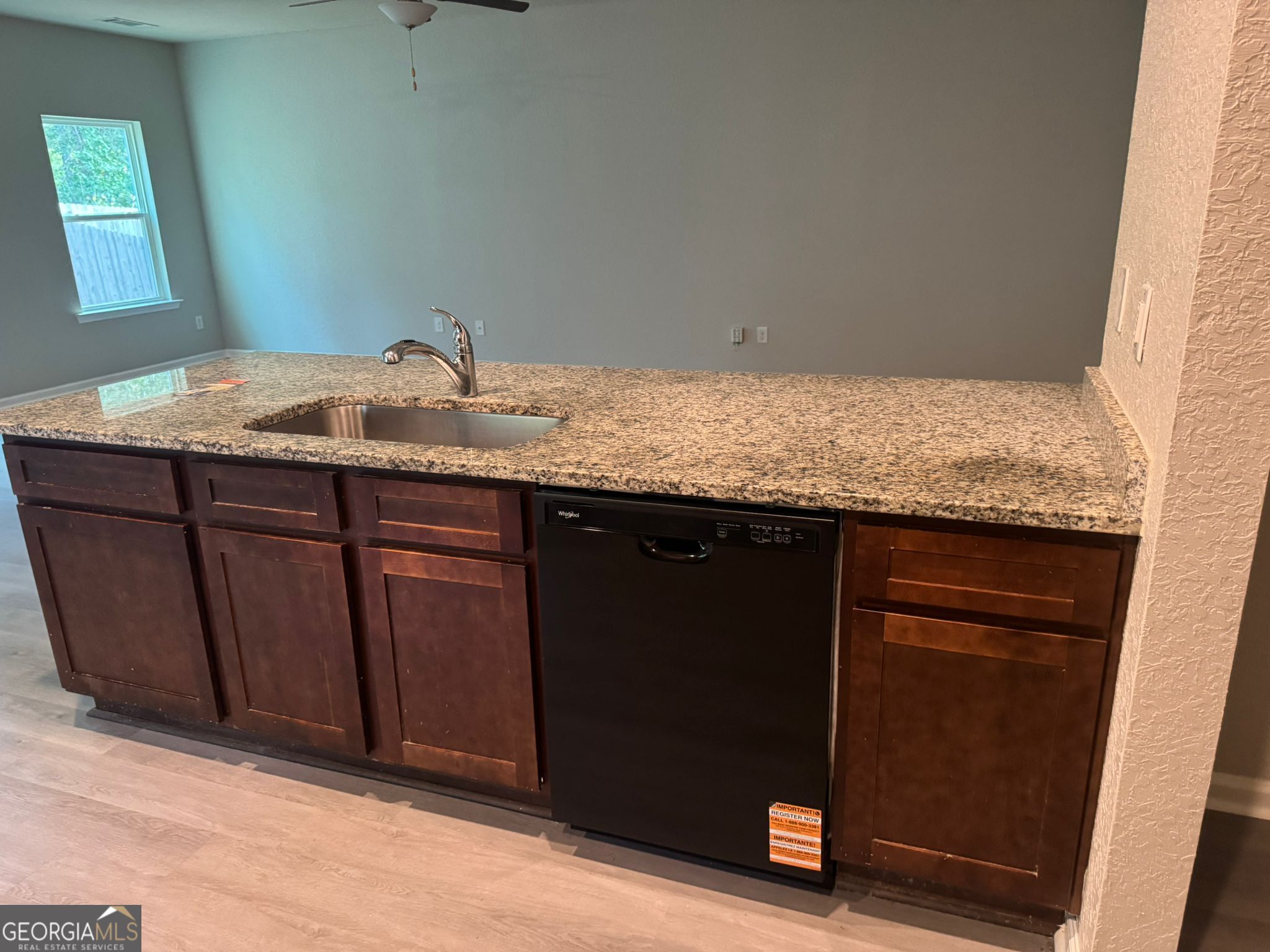 3475 Ridge Hill Parkway Douglasville, GA 30135 - Photo 32 of 34 a bathroom with a granite countertop sink and a mirror