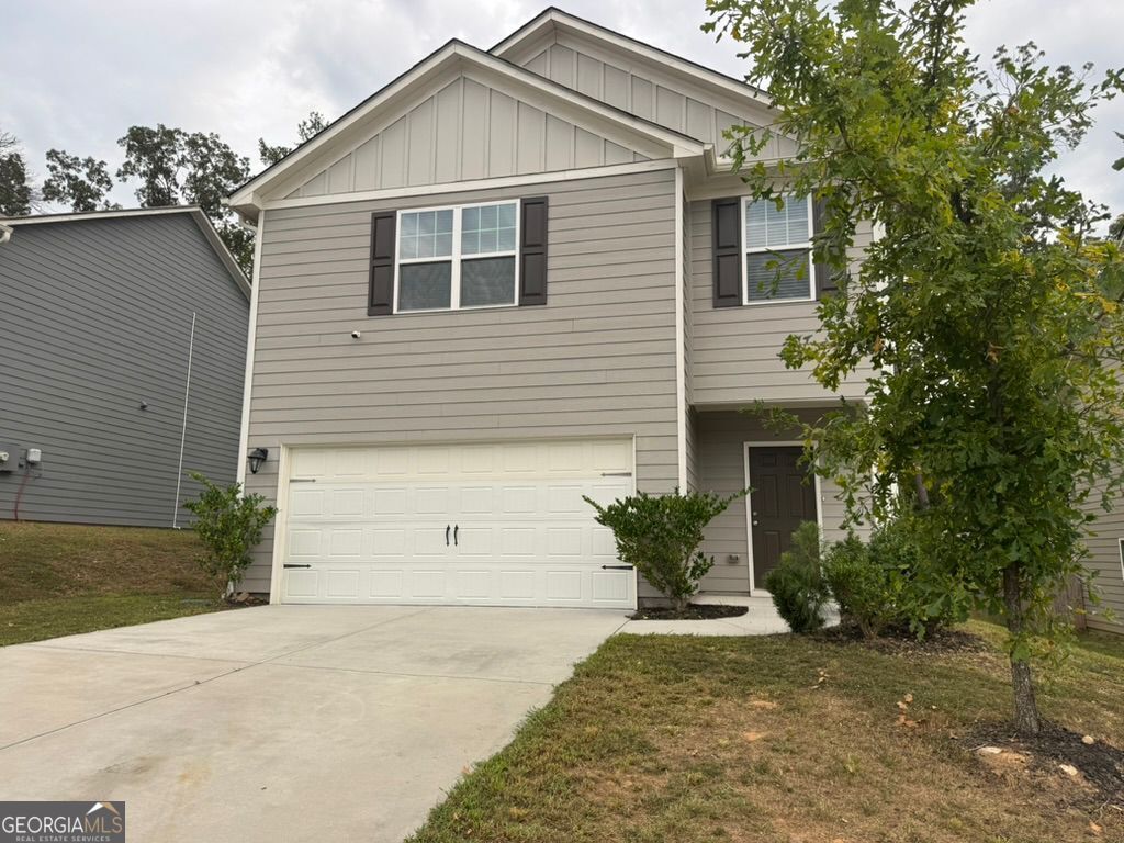 3475 Ridge Hill Parkway Douglasville, GA 30135 - Photo 34 of 34 a front view of a house with a yard and garage
