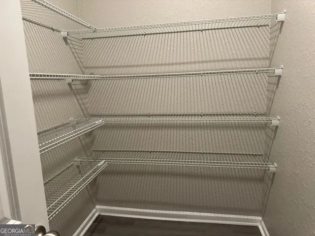 a view of a room with racks on the wall