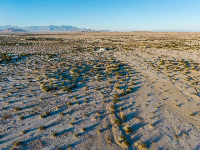 an aerial view of residential building and ocean