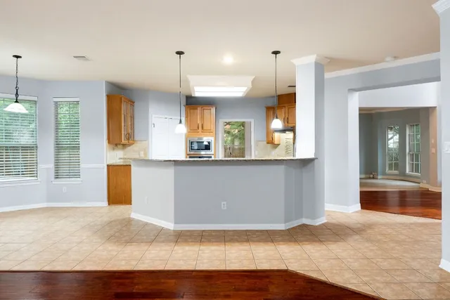 a view of a kitchen and a window