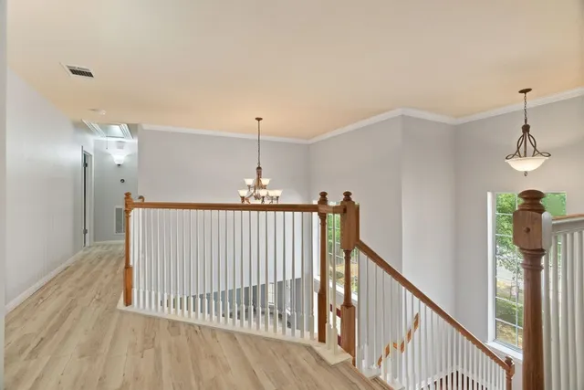 a view of a hallway view with staircase