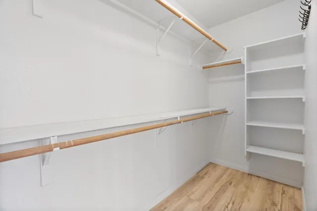 a view of a room with shelf on the wall