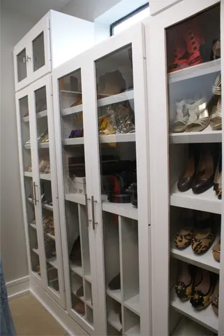 a room with a walk in closet and a window