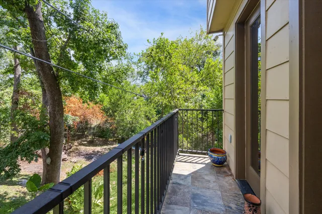 a view of a balcony with wooden floor
