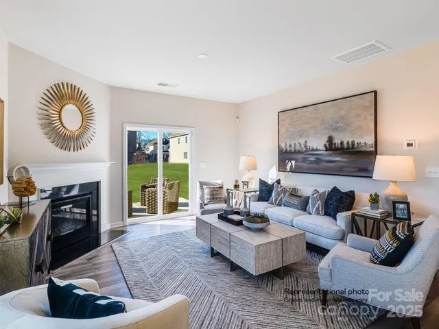 a living room with furniture and painting on wall