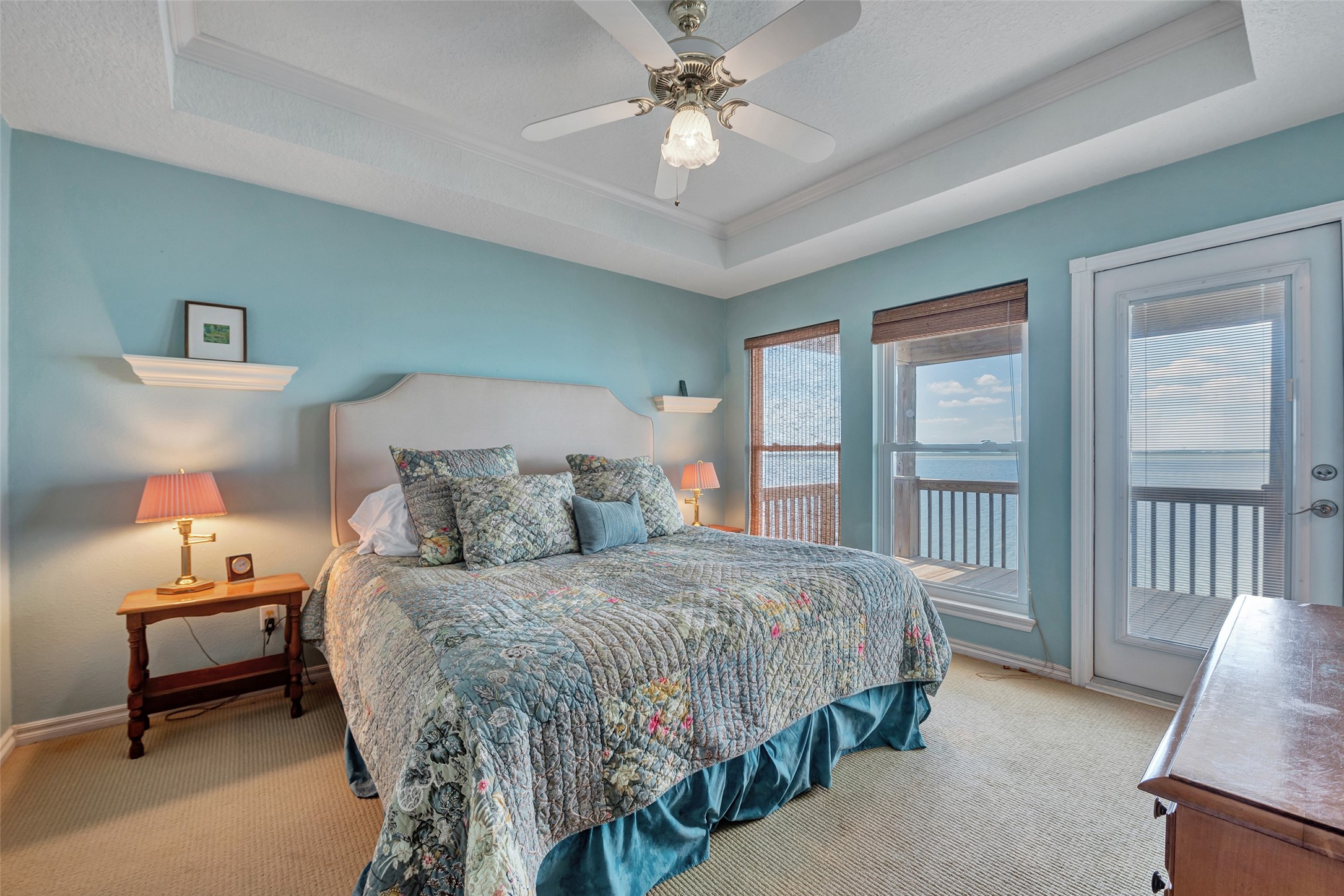 247 Isles End Road Tiki Island, TX 77554 - Photo 22 of 48 a bedroom with a bed and a chandelier