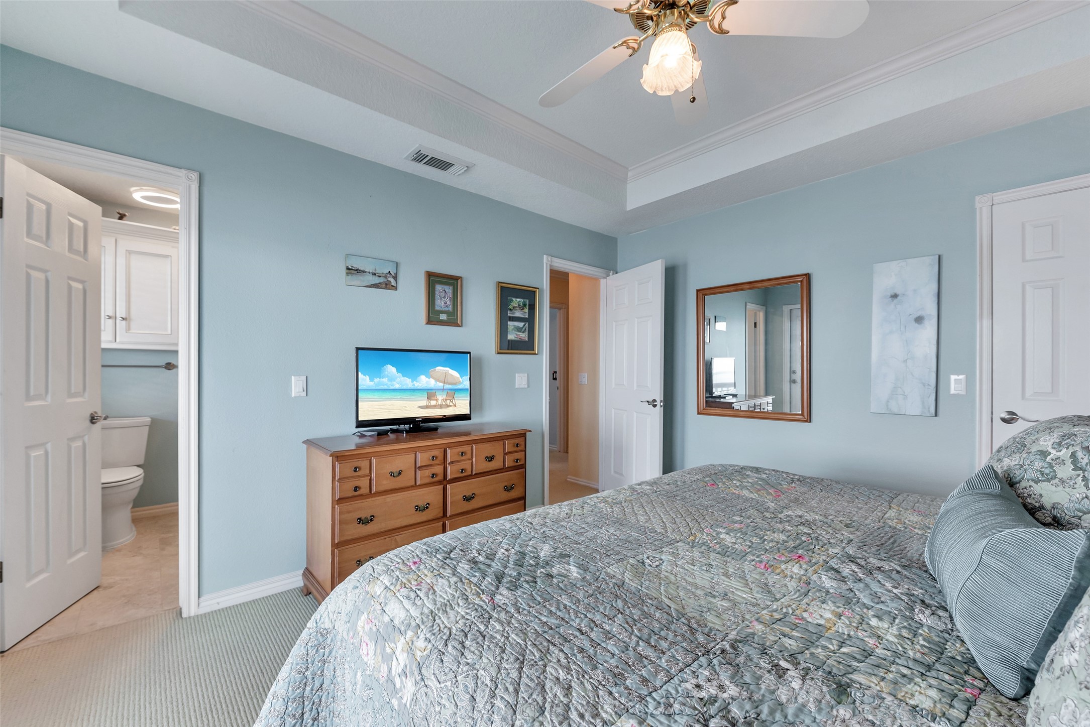 247 Isles End Road Tiki Island, TX 77554 - Photo 24 of 48 a bedroom with a bed and a flat screen tv