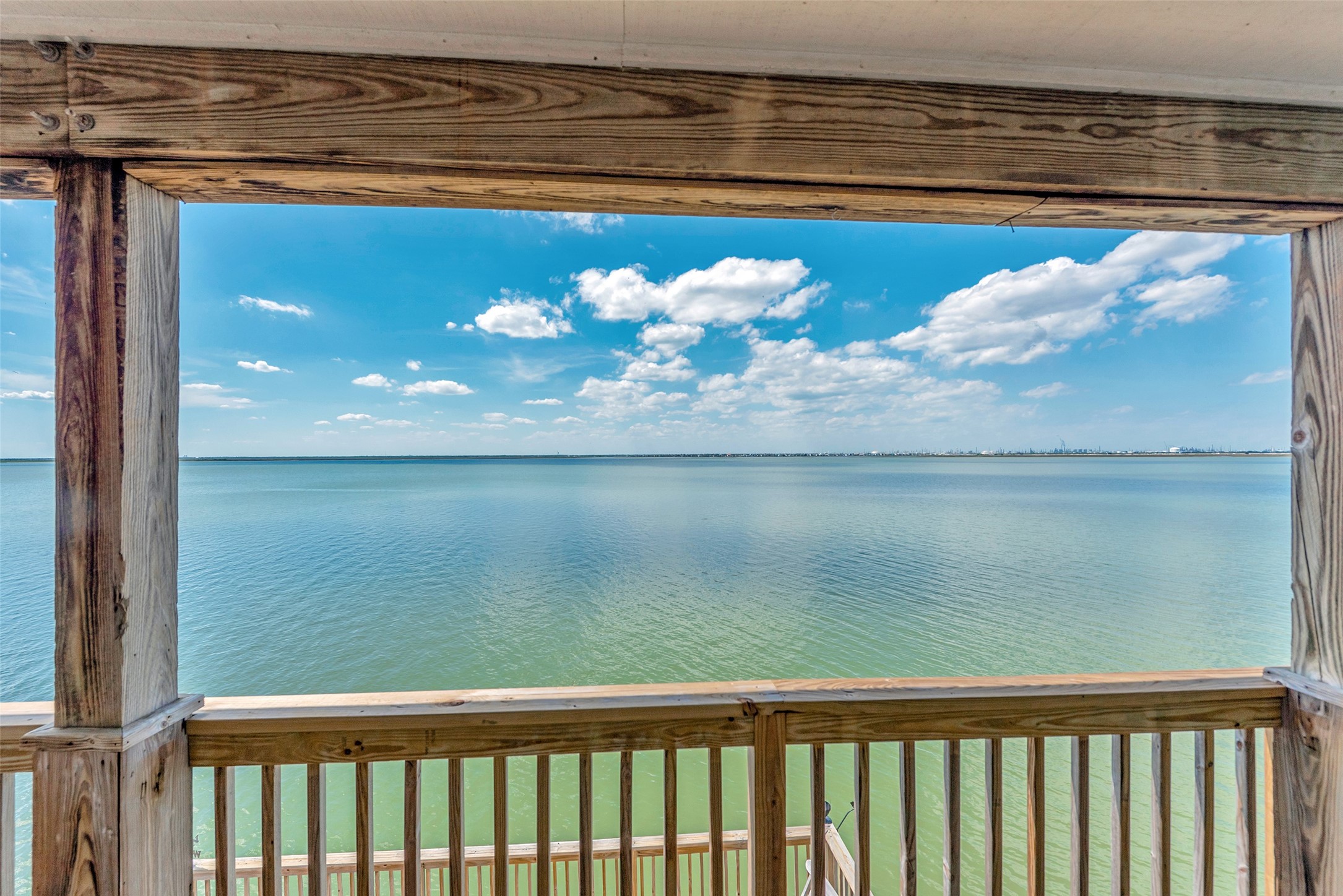 247 Isles End Road Tiki Island, TX 77554 - Photo 28 of 48 a view of a lake from a balcony