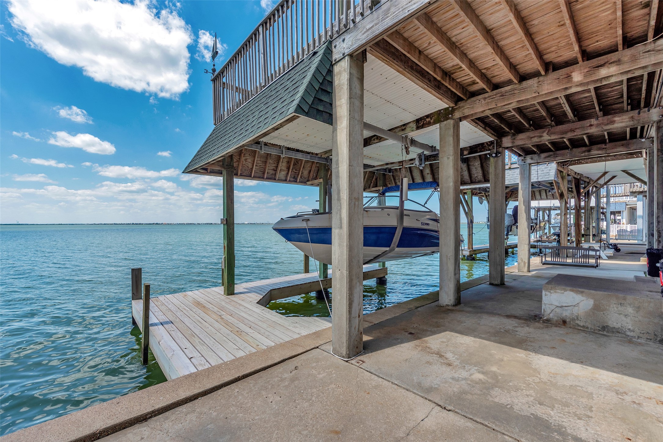 247 Isles End Road Tiki Island, TX 77554 - Photo 30 of 48 Launch your boat for a day on the bay or cast a line right from your back area, this setup makes it easy to enjoy life by the water. Everything’s right here—boat lift, dock, and plenty of room to fish or relax.