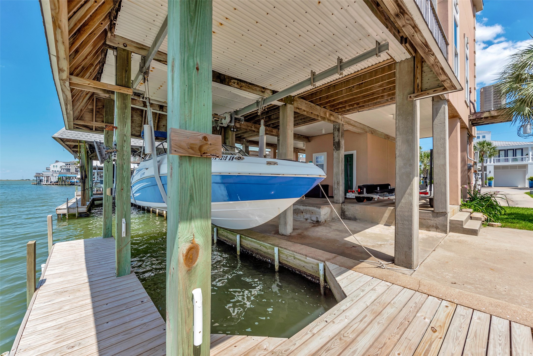 247 Isles End Road Tiki Island, TX 77554 - Photo 31 of 48 The covered boat lift easily supports a 19-foot jet boat weighing in at around 2,400 pounds. Whether you're heading out for water sports or a calm evening cruise, this setup makes it simple to launch and dock right from your own back deck.