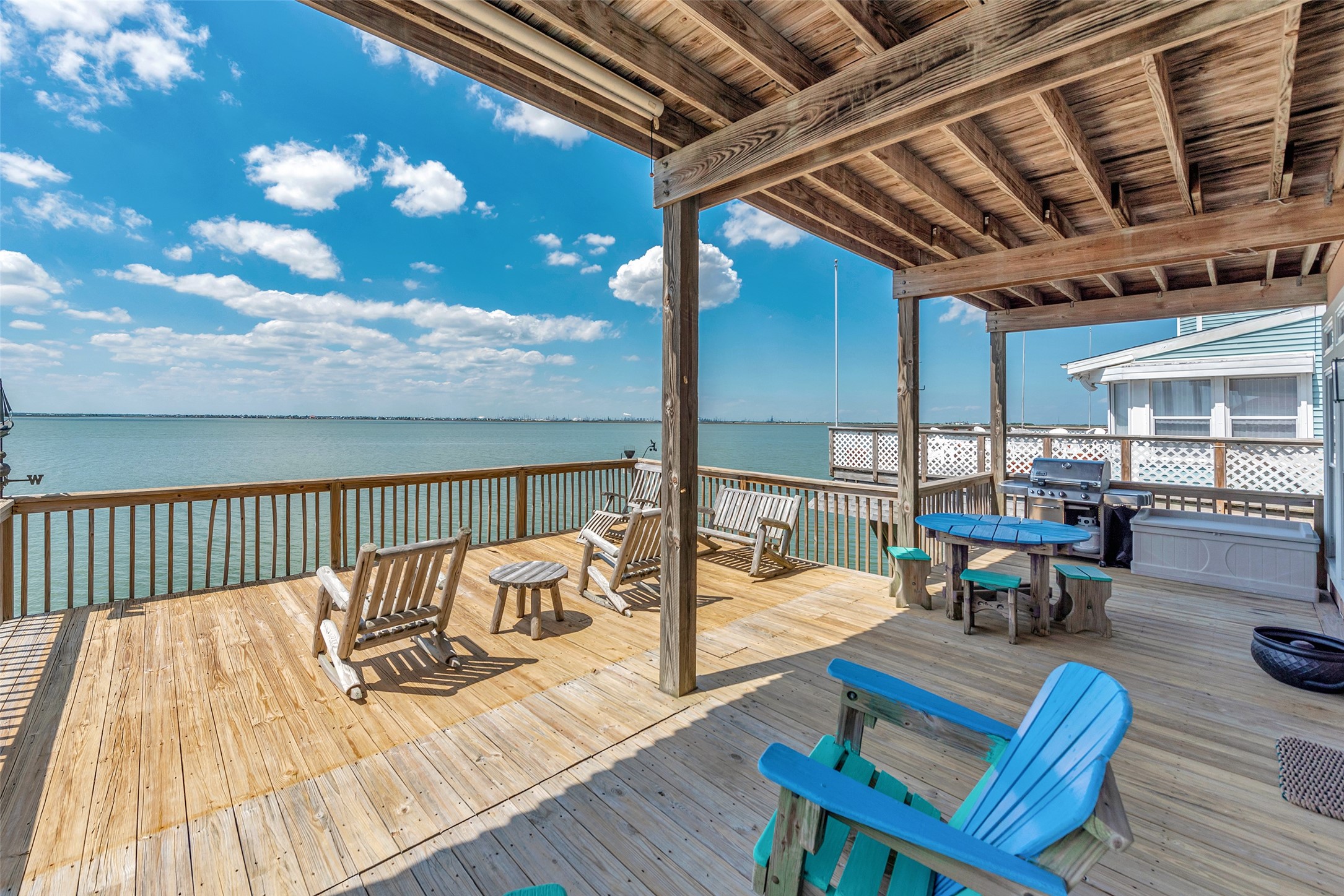 247 Isles End Road Tiki Island, TX 77554 - Photo 35 of 48 This upper deck offers both covered and open areas, with plenty of space for dining, lounging, and enjoying time around the included outdoor furniture.