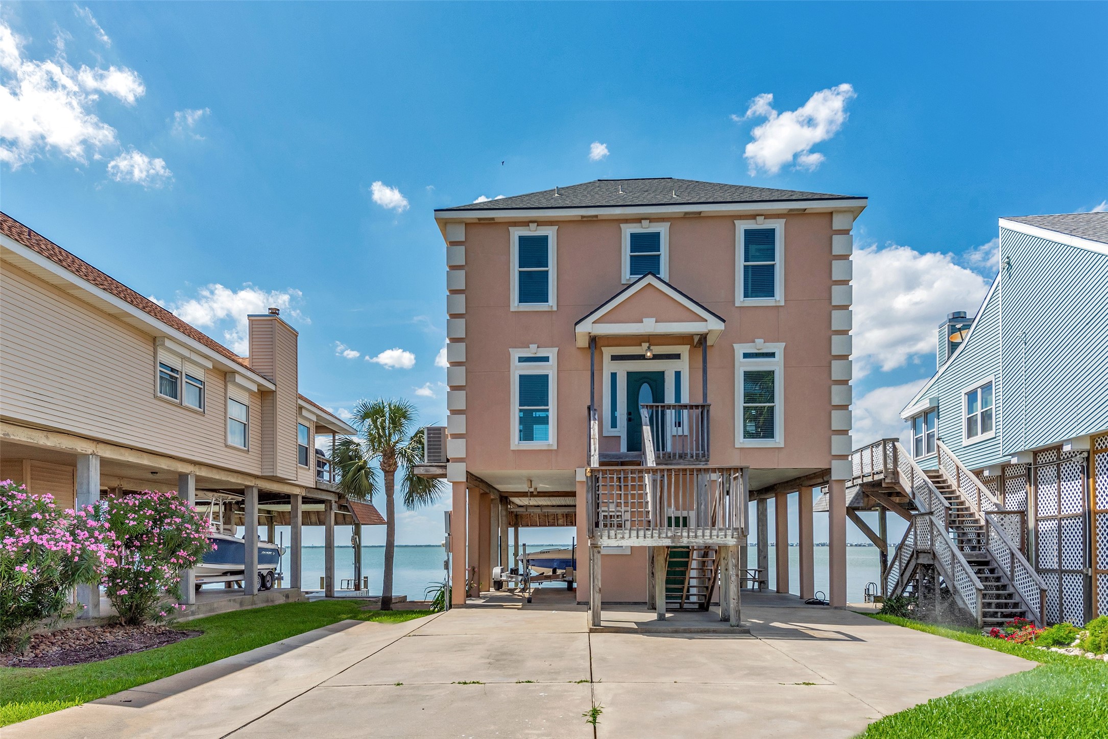 247 Isles End Road Tiki Island, TX 77554 - Photo 43 of 48 a front view of a house with a yard
