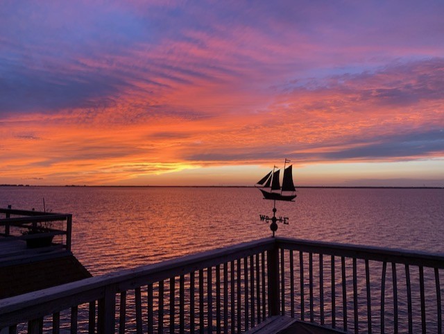 247 Isles End Road Tiki Island, TX 77554 - Photo 47 of 48 The spacious waterfront deck offers a private backdrop of sunsets that you'll look forward to every evening.