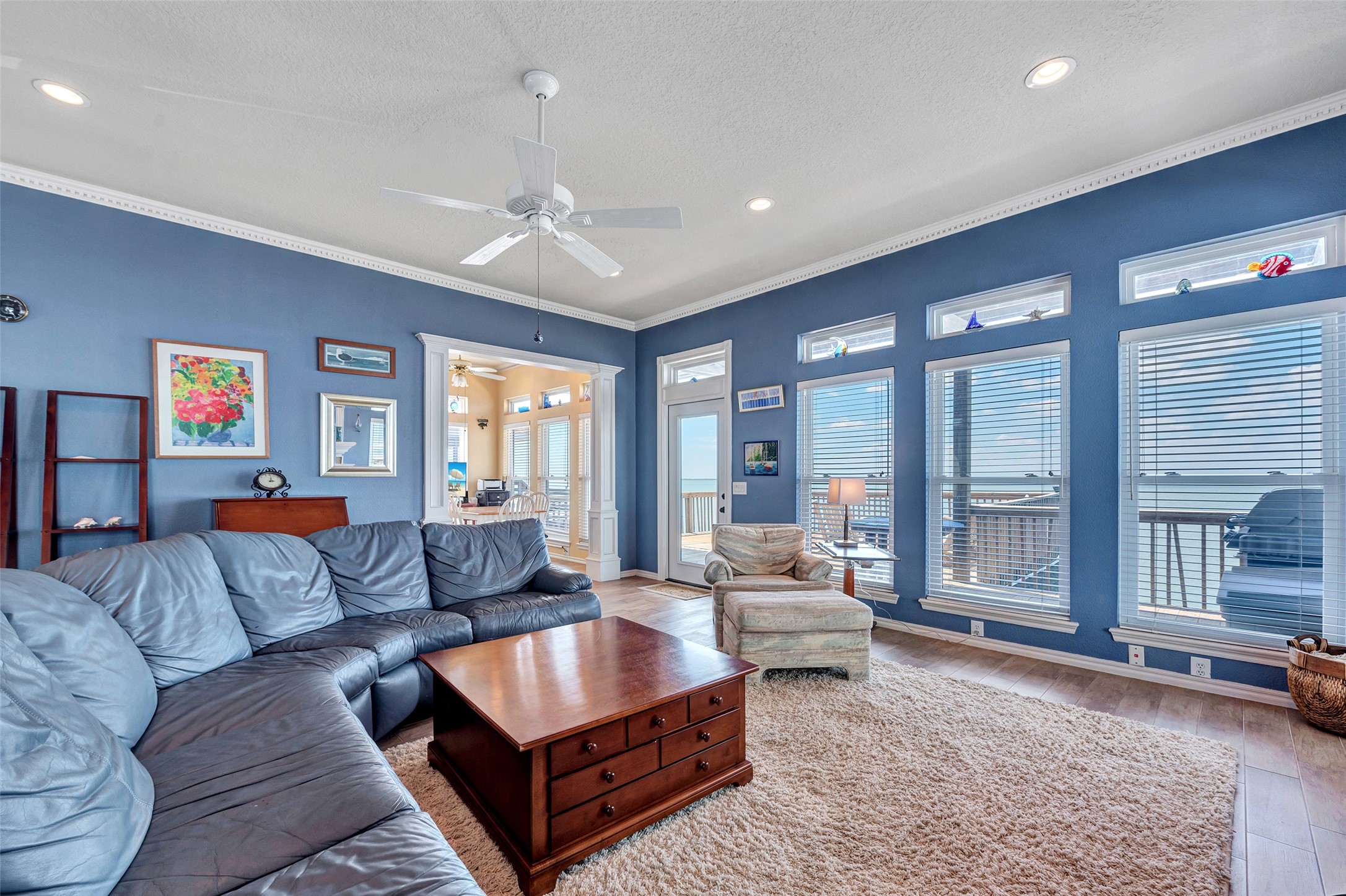 247 Isles End Road Tiki Island, TX 77554 - Photo 6 of 48 a living room with furniture and a large window