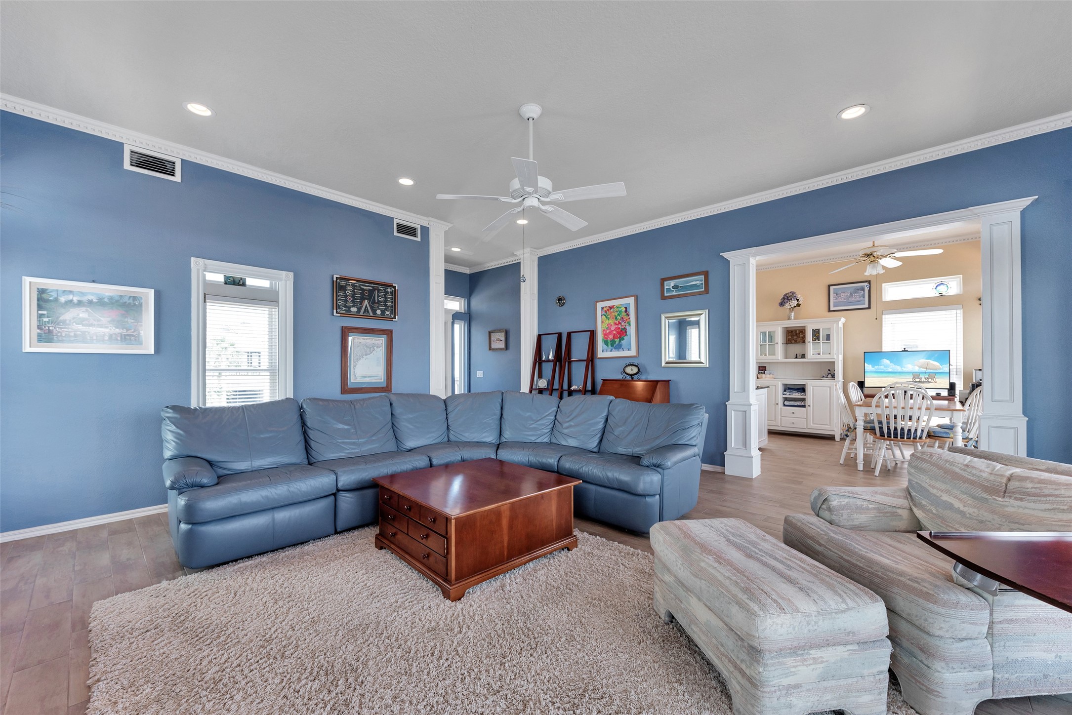 247 Isles End Road Tiki Island, TX 77554 - Photo 7 of 48 a living room with furniture and a wooden floor