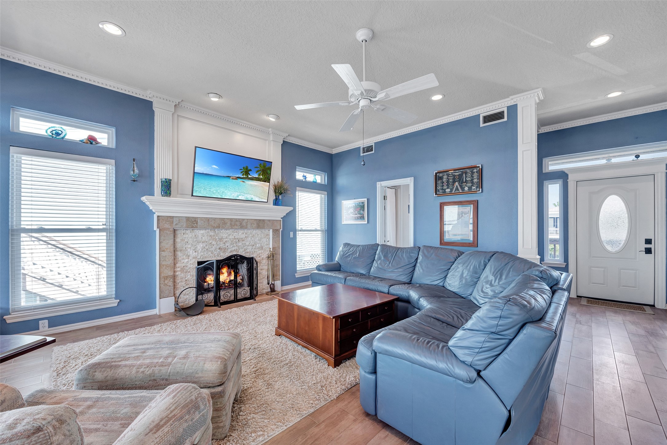247 Isles End Road Tiki Island, TX 77554 - Photo 8 of 48 a living room with furniture and a fireplace
