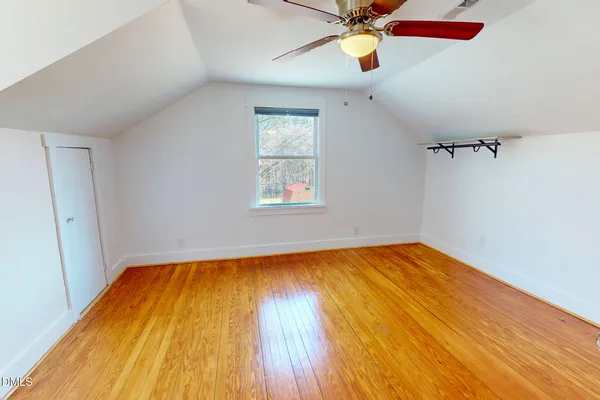 wooden floor in a room next to a window