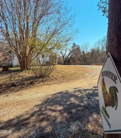 a view of a yard with snow on the road